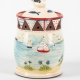 A photo of a garlic jar with patchwork and seaside decoration
